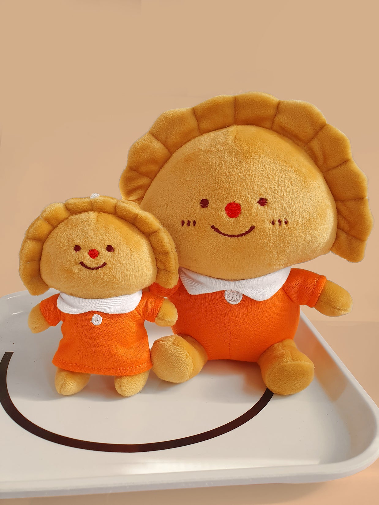 "Empanada" 7" Plush and mini-plush Keychain. Designed by Natalí Koromoto Martínez.