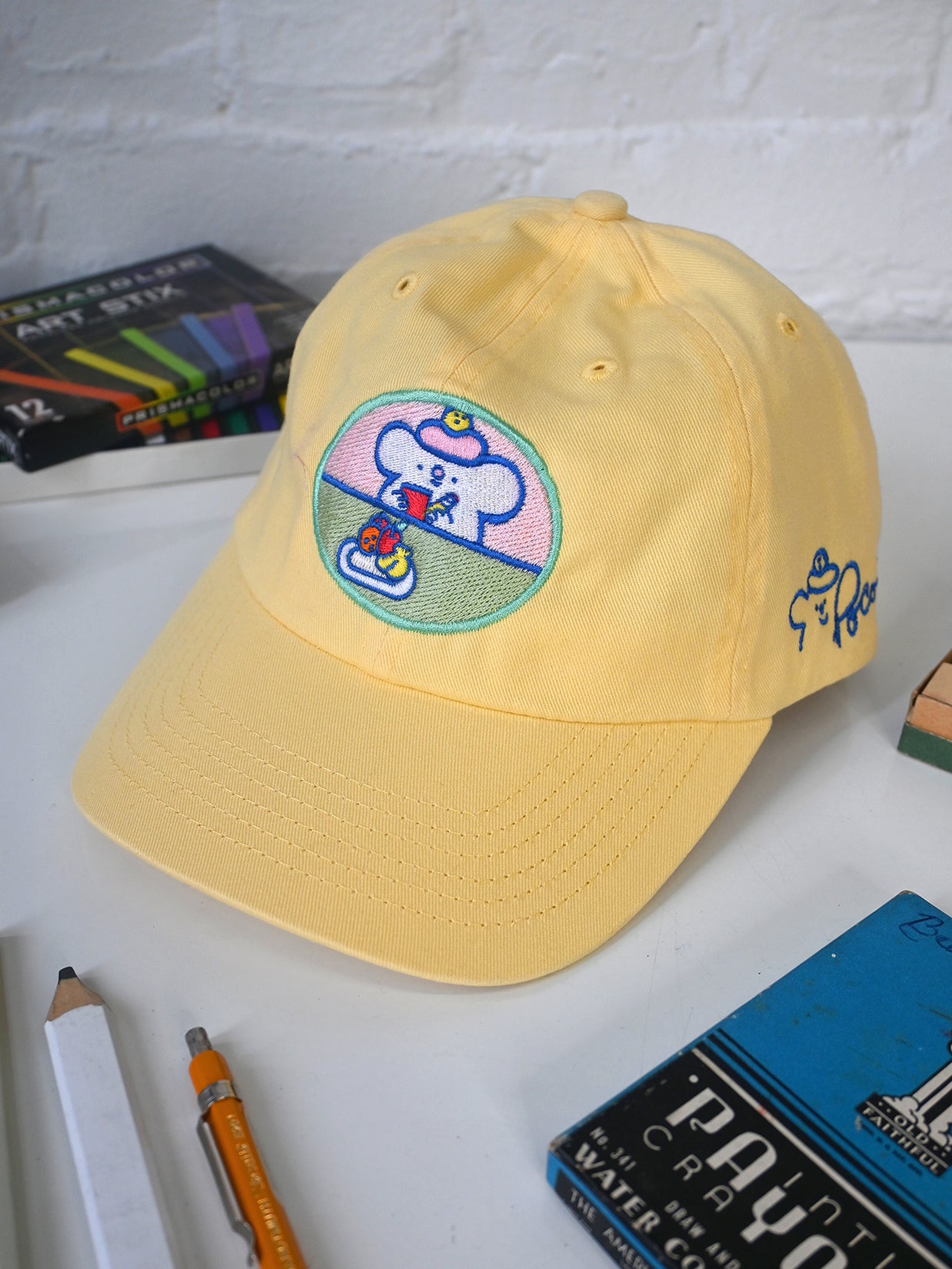 "Still Life with Poco" Cap design by Natali Koromoto.