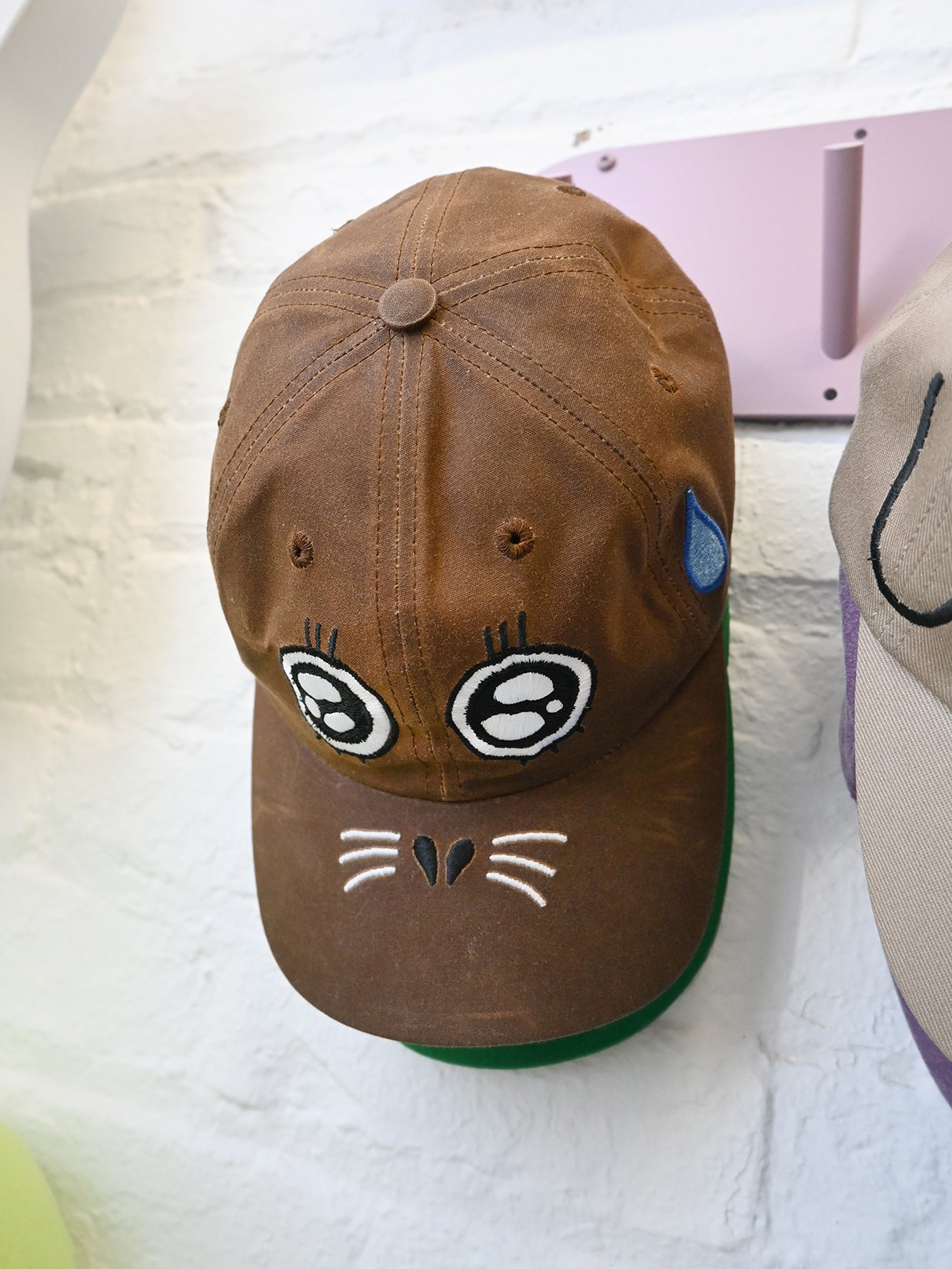 "ARGH-ARGH/SEAL" embroidered Cap design by Natali Koromoto. Made by Ho Hos Hole in The Wall. Waxed 100% cotton. Made in NYC.