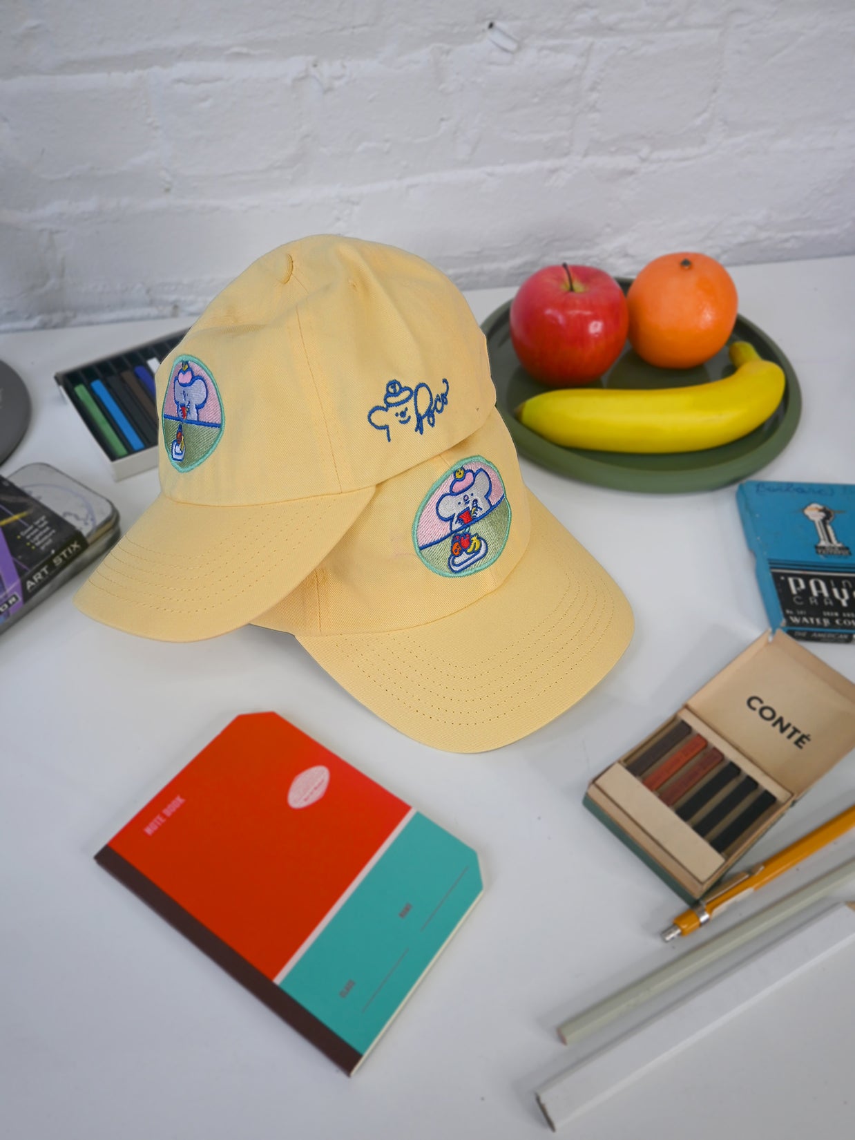 "Still Life with Poco" Cap design by Natali Koromoto.