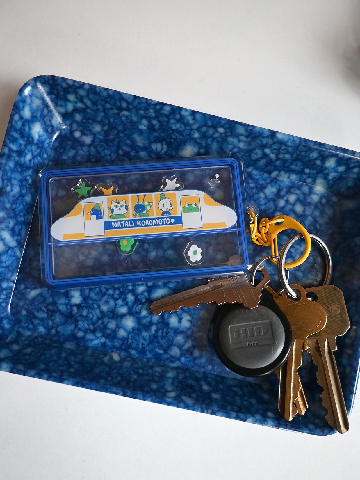 "Passengers" Keychain. Design by Natali Koromoto