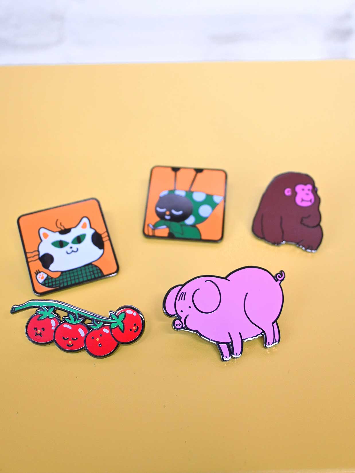 "You say tomato, I say tomate" Enamel Pin. Design by Natali Koromoto Martinez (NYC)