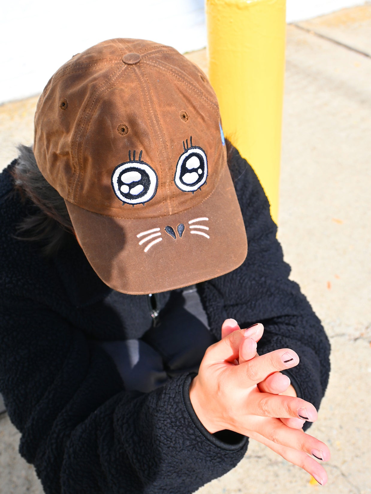 "ARGH-ARGH/SEAL" embroidered Cap design by Natali Koromoto. Made by Ho Hos Hole in The Wall. Waxed 100% cotton. Made in NYC.