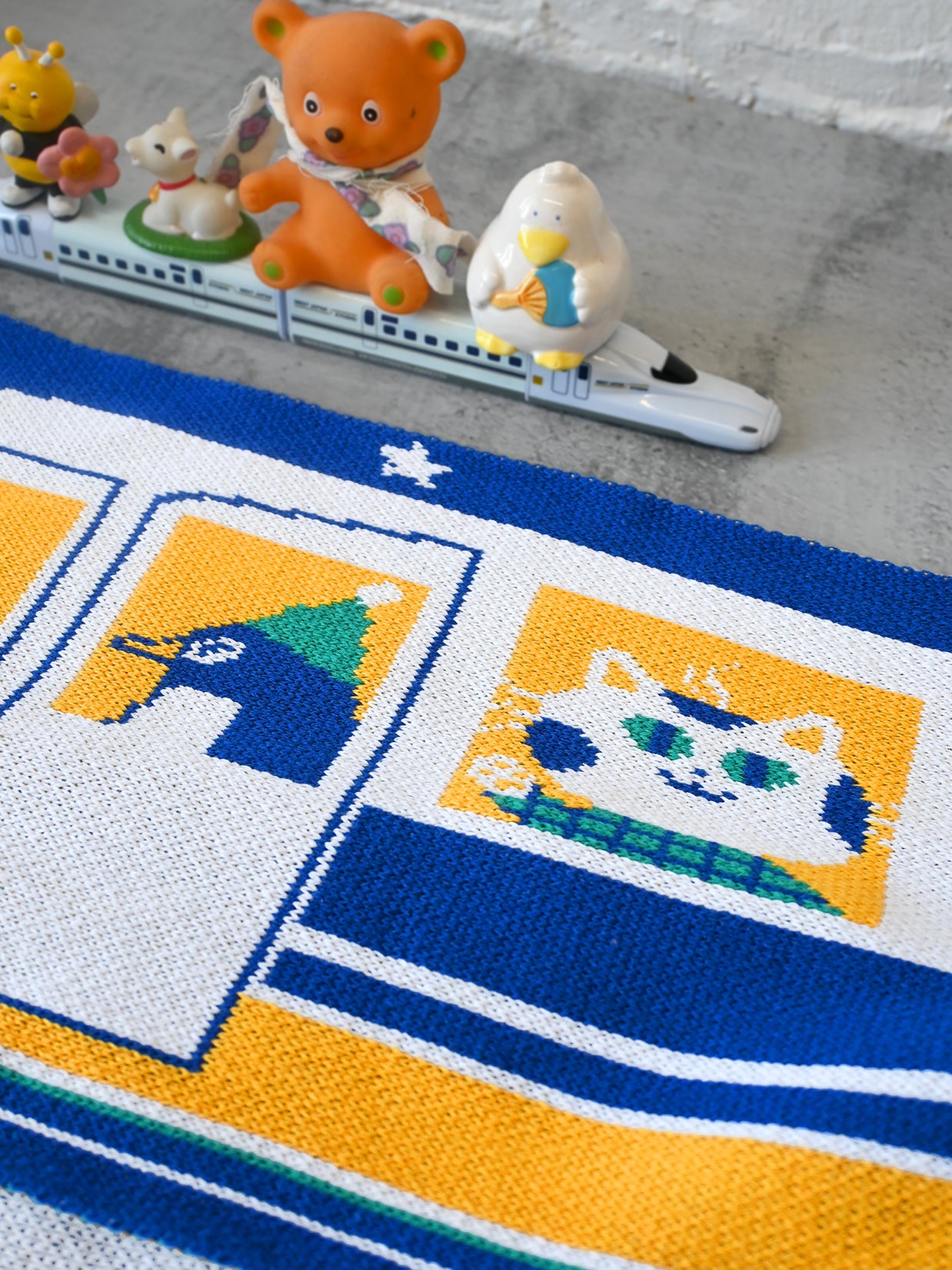 "The Passengers" Jumbo scarf -Design by Natali Koromoto. Inspired by travels on the Japanese Shinkansen bullet train. Scarf knit in Long Island, New York. 50/50 Rec. Poly + Rec. Cotton.