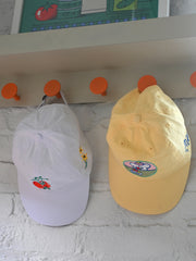 "Still Life with Poco" Cap design by Natali Koromoto.