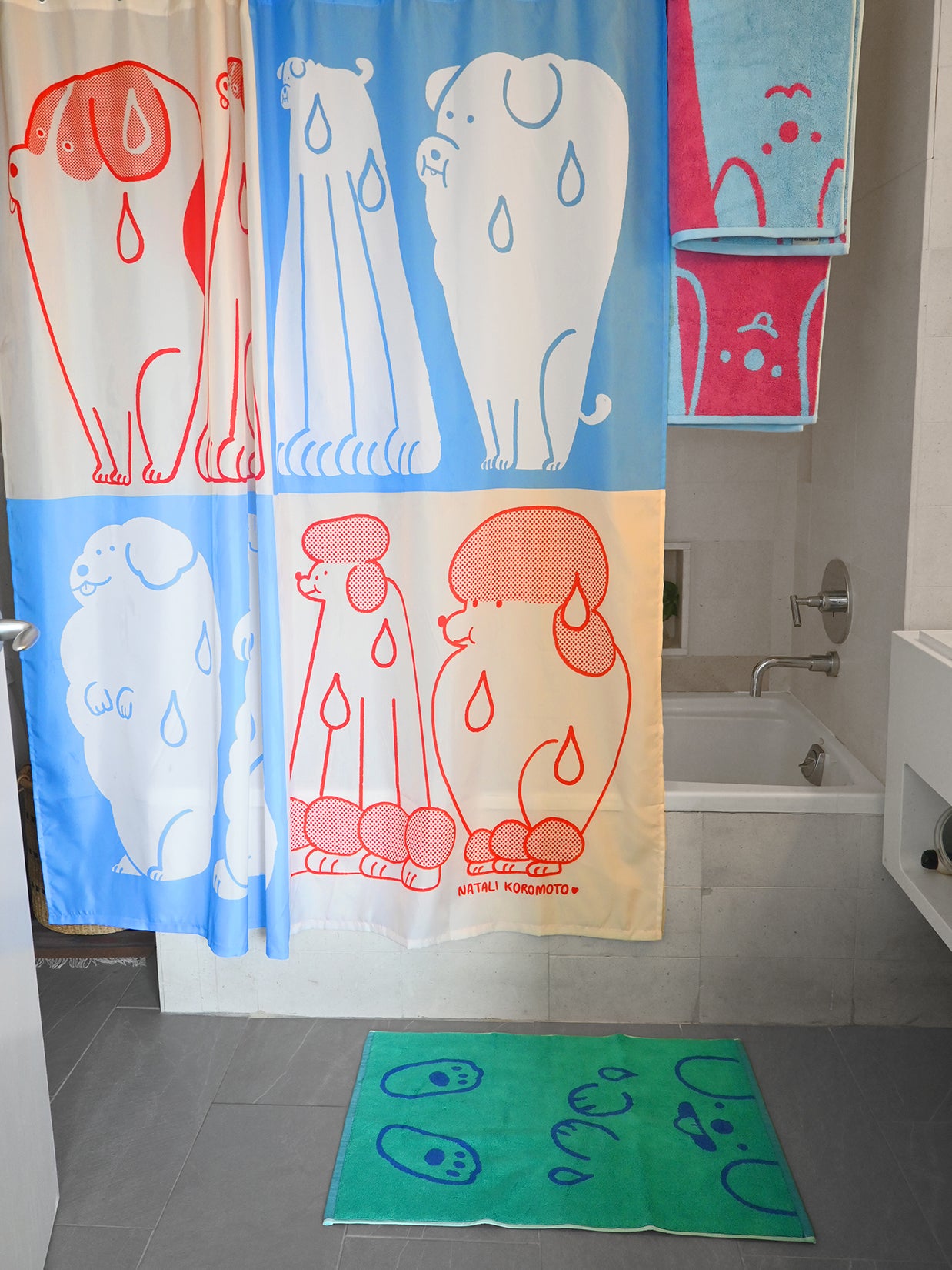 Part of the "Wet Dogs" bath collection by illustrator Natali Koromoto. "Wet Dogs" shower curtain.