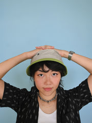 Natali Koromoto x HO HOS HOLE IN THE WALL brands "Ants on Your Hat"  print design bucket hat in Pearl Grey and Avocado Green dye colorway organic cotton fabric combo