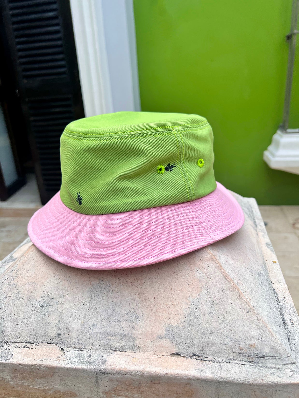 Natali Koromoto x HO HOS HOLE IN THE WALL brand "Ants on Your Hat" printed bucket hat in Avocado Green and True Pink dye colorway combo