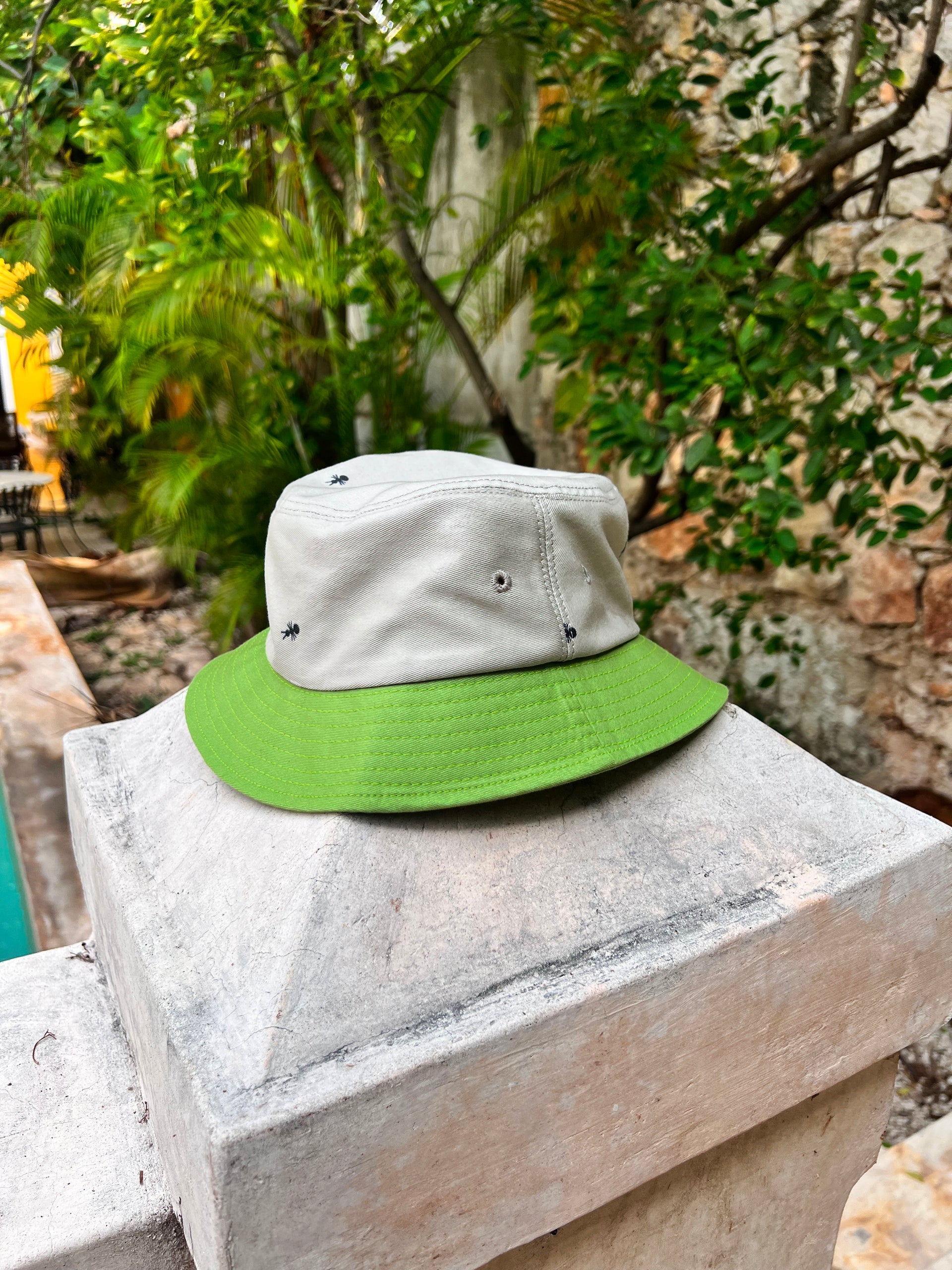 Natali Koromoto x HO HOS HOLE IN THE WALL brands "Ants on Your Hat"  print design bucket hat in Pearl Grey and Avocado Green dye colorway organic cotton fabric combo