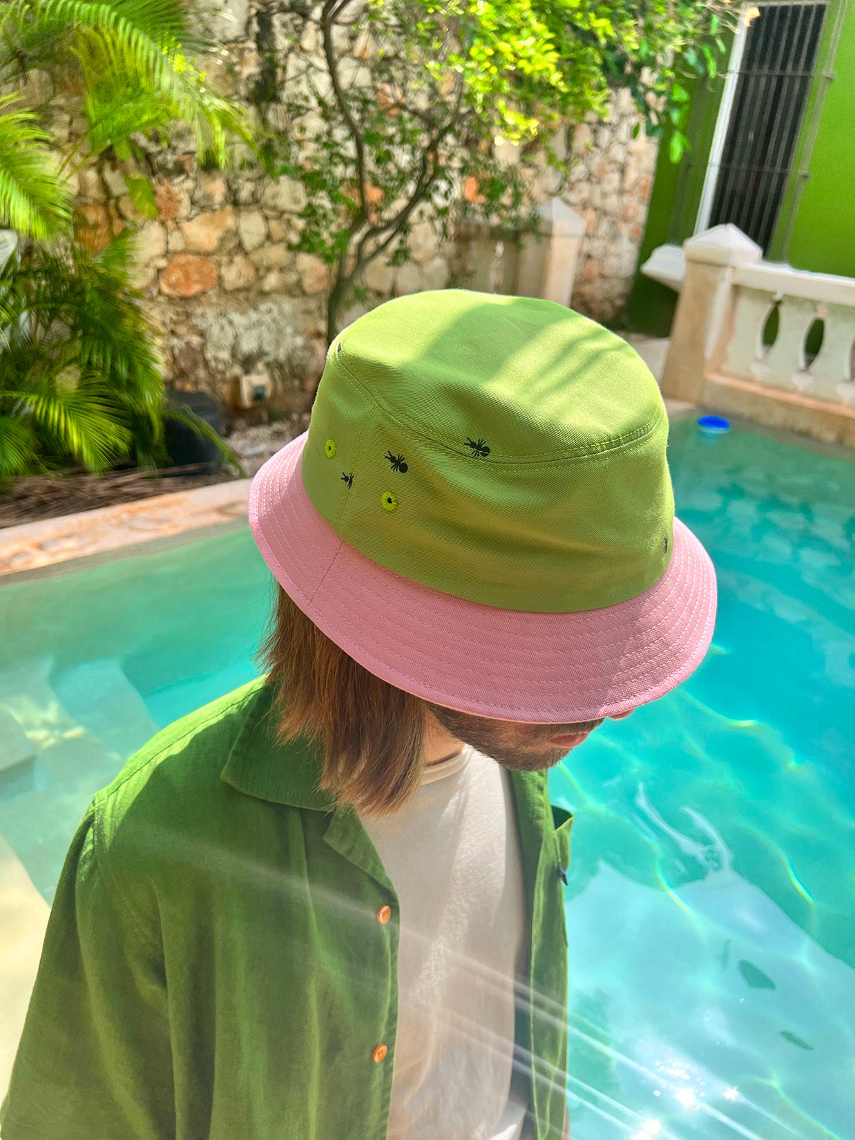 Natali Koromoto x HO HOS HOLE IN THE WALL brand "Ants on Your Hat" printed bucket hat in Avocado Green and True Pink dye colorway combo