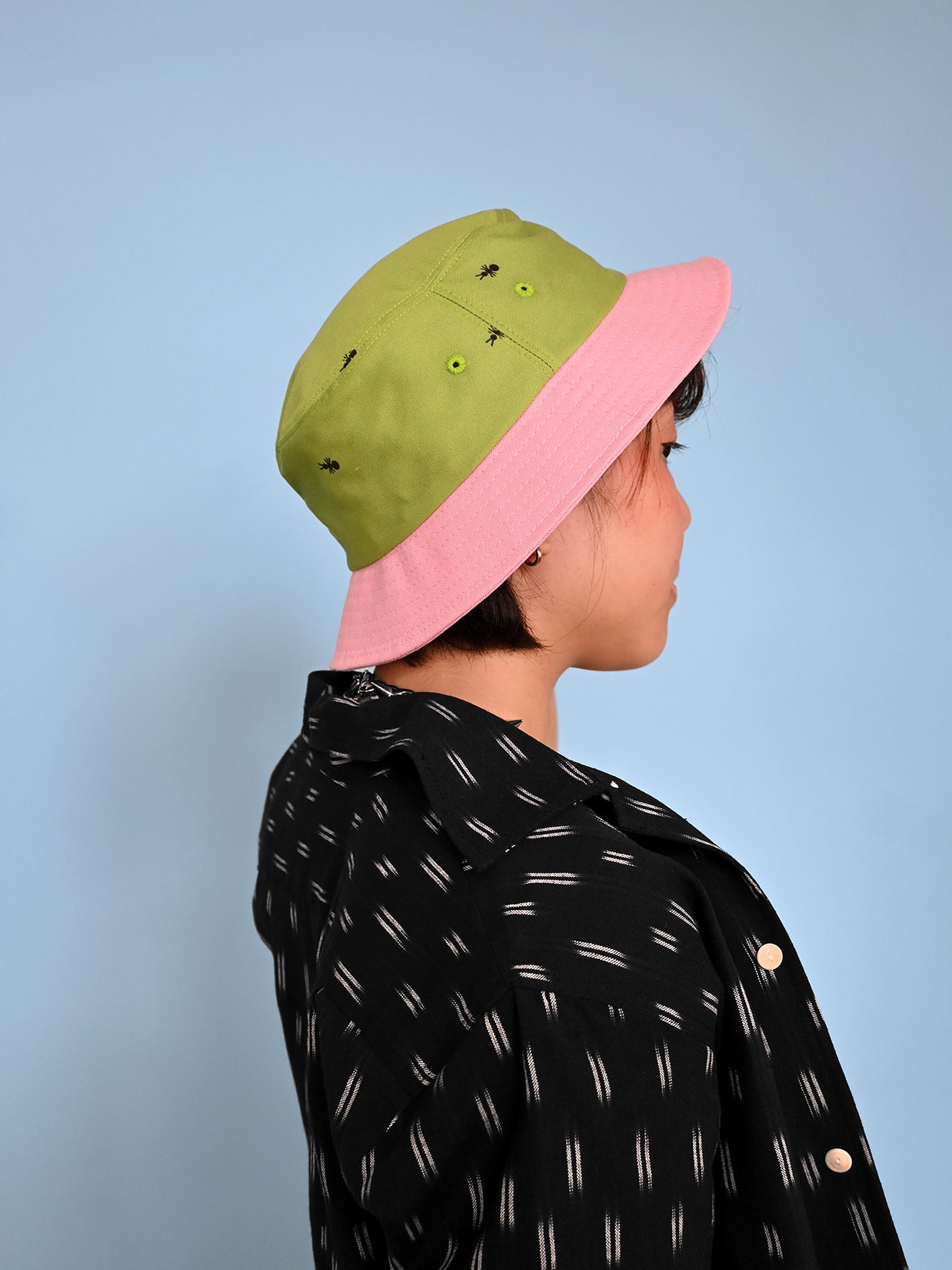 Natali Koromoto x HO HOS HOLE IN THE WALL brand "Ants on Your Hat" printed bucket hat in Avocado Green and True Pink dye colorway combo