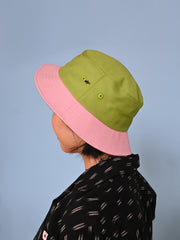 Natali Koromoto x HO HOS HOLE IN THE WALL brand "Ants on Your Hat" printed bucket hat in Avocado Green and True Pink dye colorway combo