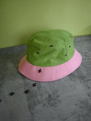 Natali Koromoto x HO HOS HOLE IN THE WALL brand "Ants on Your Hat" printed bucket hat in Avocado Green and True Pink dye colorway combo