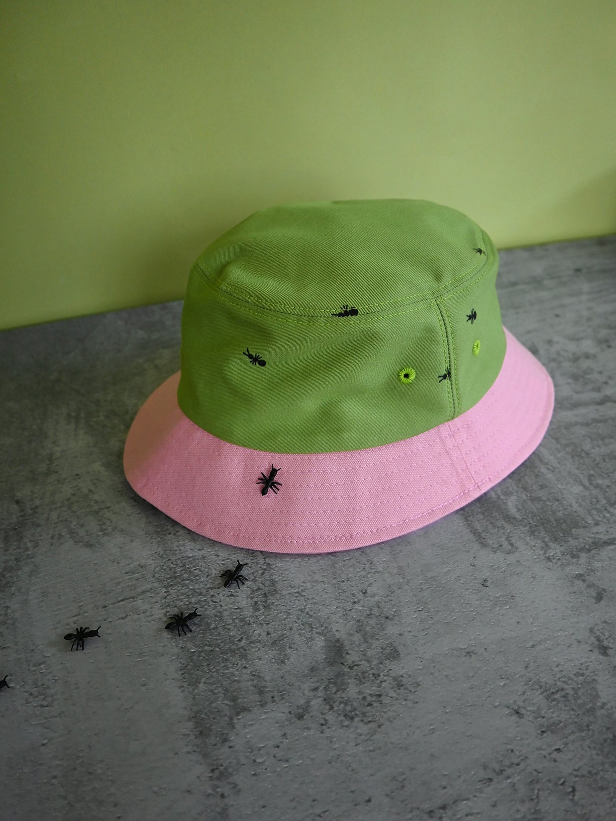 Natali Koromoto x HO HOS HOLE IN THE WALL brand "Ants on Your Hat" printed bucket hat in Avocado Green and True Pink dye colorway combo
