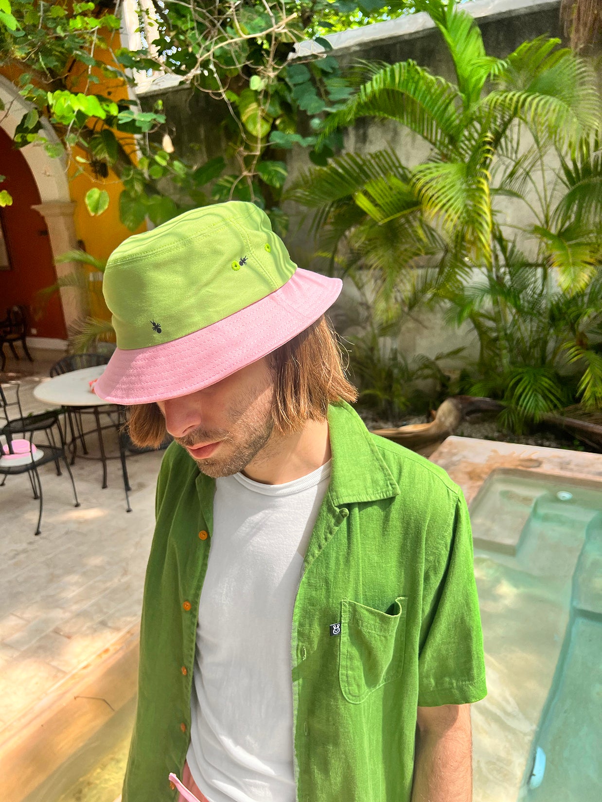 Natali Koromoto x HO HOS HOLE IN THE WALL brand "Ants on Your Hat" printed bucket hat in Avocado Green and True Pink dye colorway combo
