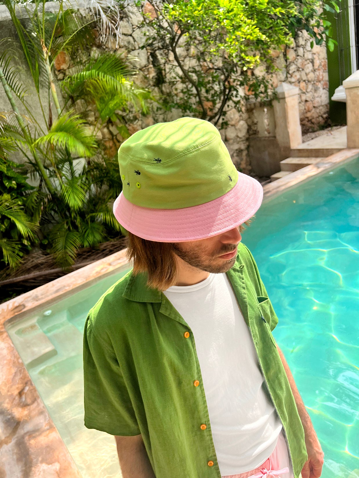 Natali Koromoto x HO HOS HOLE IN THE WALL brand "Ants on Your Hat" printed bucket hat in Avocado Green and True Pink dye colorway combo