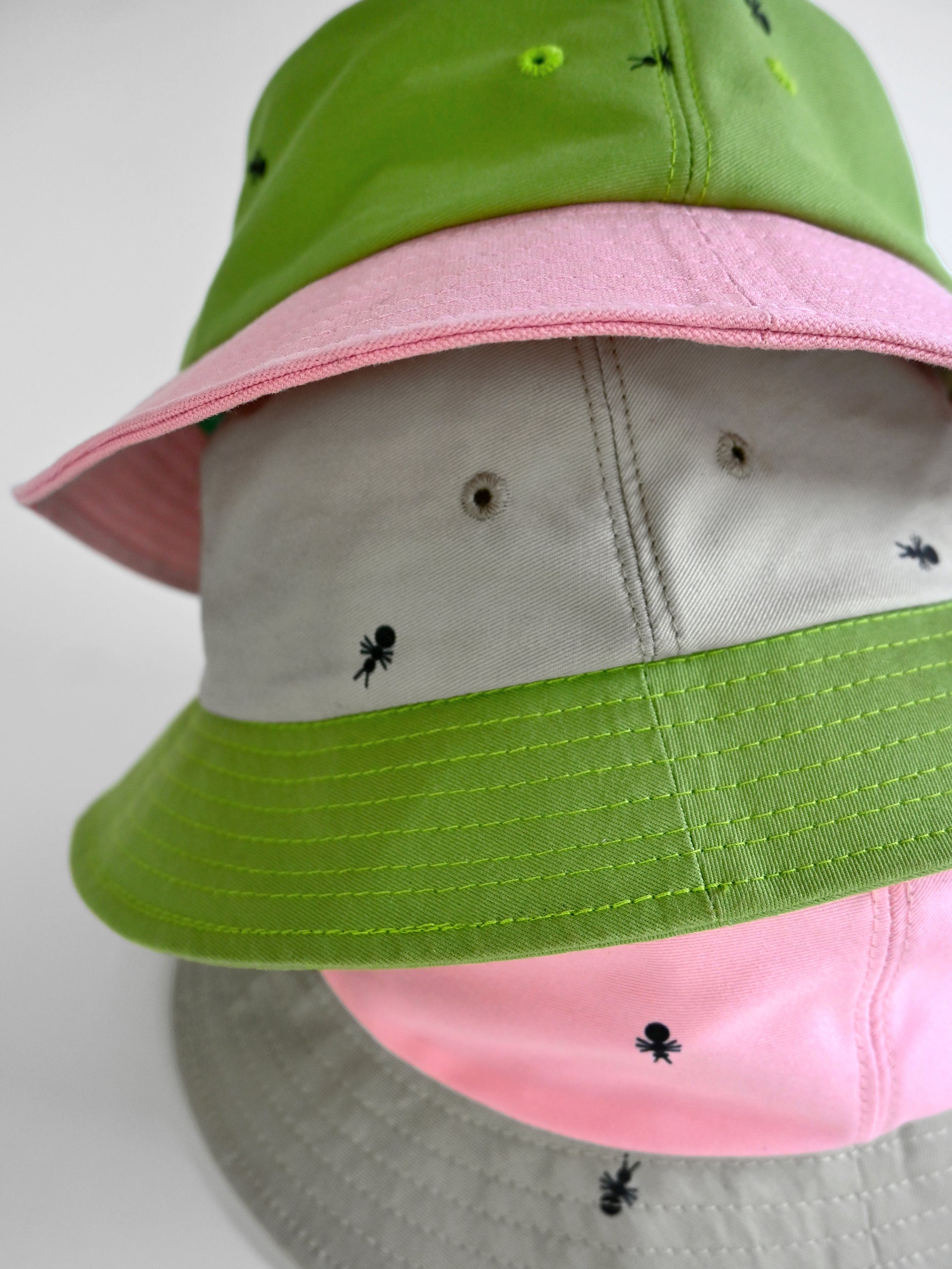 Natali Koromoto x HO HOS HOLE IN THE WALL brand "Ants on Your Hat" printed bucket hat in Avocado Green and True Pink dye colorway combo