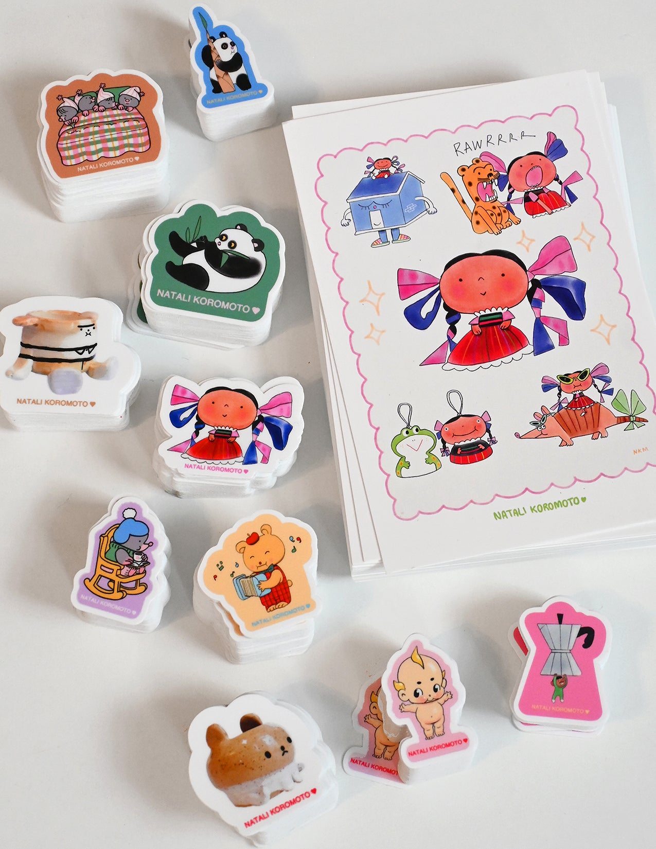 Pack of 10 vinyl stickers, Sticky Friends Edition #4. Designs by Natali Koromoto.
Includes one 4" x 6" postcard.