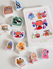 Pack of 10 vinyl stickers, Sticky Friends Edition #4. Designs by Natali Koromoto.
Includes one 4" x 6" postcard.