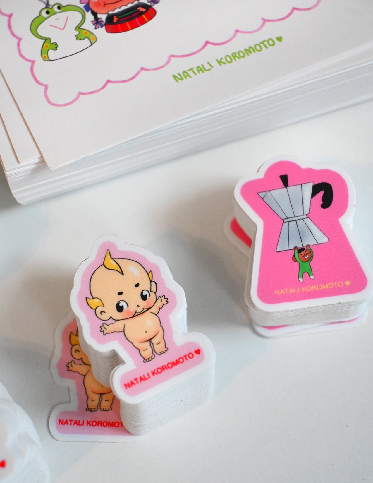 Pack of 10 vinyl stickers, Sticky Friends Edition #4. Designs by Natali Koromoto.
Includes one 4" x 6" postcard.