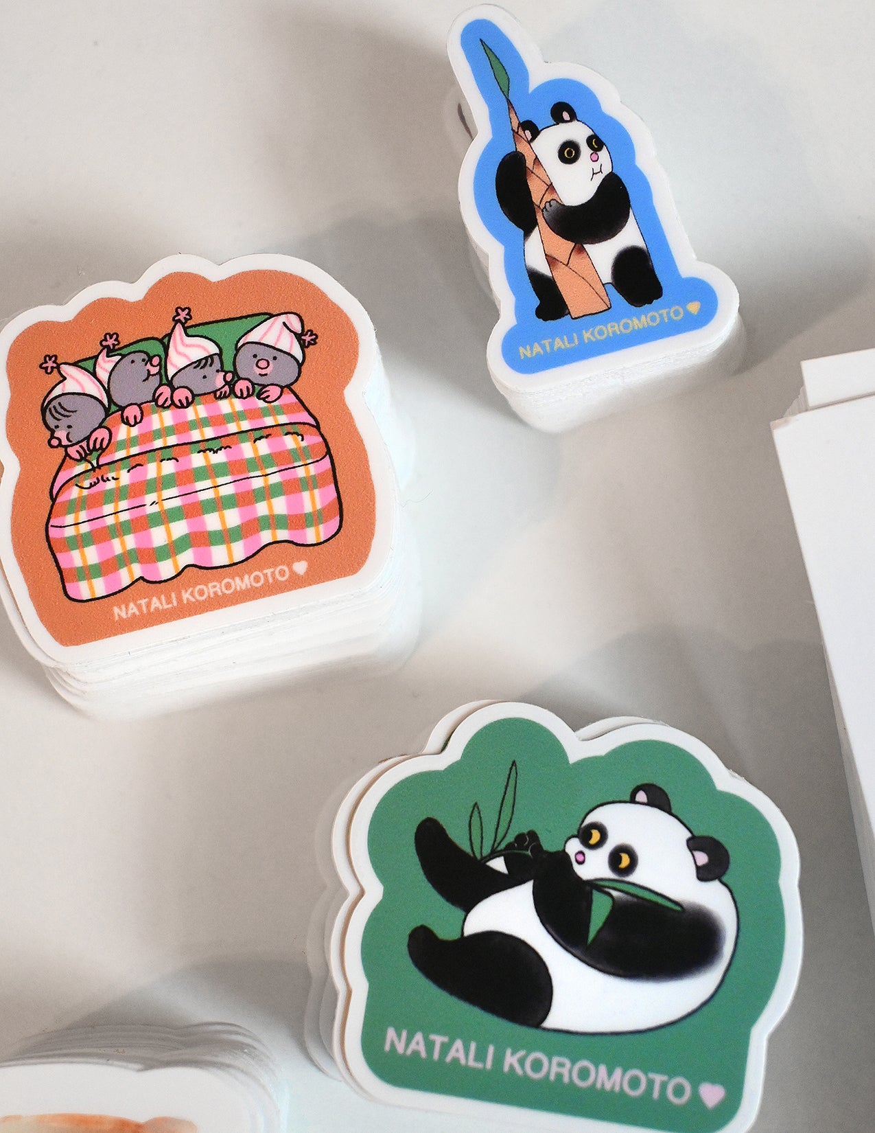 Pack of 10 vinyl stickers, Sticky Friends Edition #4. Designs by Natali Koromoto.
Includes one 4" x 6" postcard.
