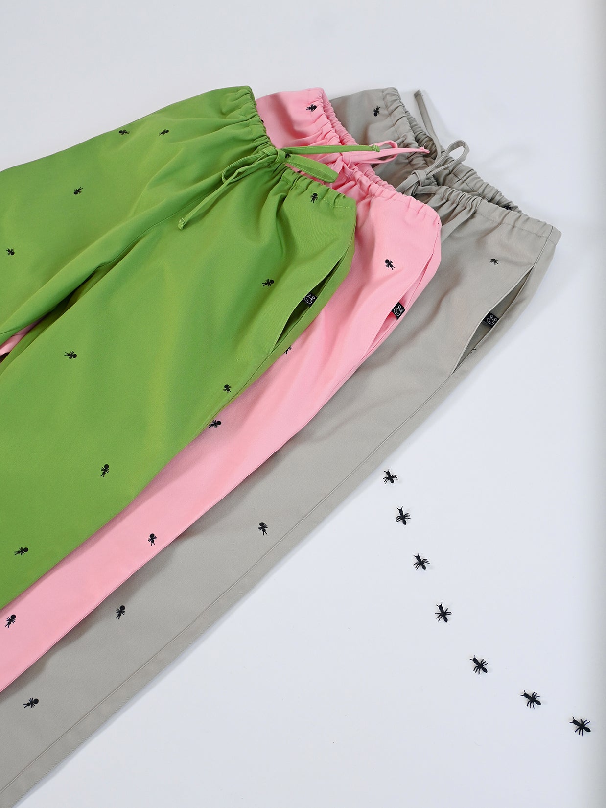 Natali Koromoto x Ho Hos Hole in The Wall brand "Ants on Your Pants" custom print design in Pink Lemonade dye colorway. Unisex regular fit lounge pull-on pant with elastic waist. USA-milled 100% organic cotton, dyed and printed with non-toxic, low-impact dyes and inks. Machine wash OK. Sizes 2XS-3XL. Made in NYC.