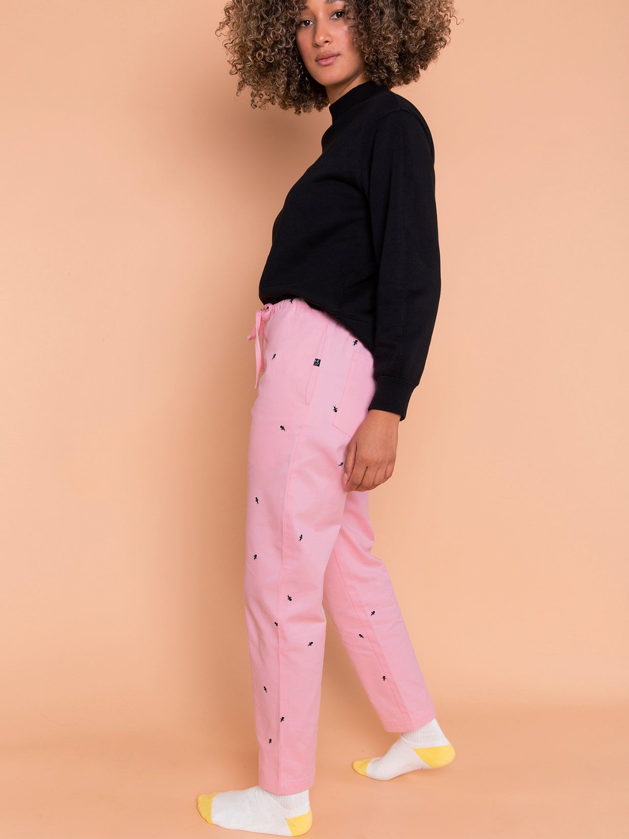 Natali Koromoto x Ho Hos Hole in The Wall brand "Ants on Your Pants" custom print design in Pink Lemonade dye colorway. Unisex regular fit lounge pull-on pant with elastic waist. USA-milled 100% organic cotton, dyed and printed with non-toxic, low-impact dyes and inks. Machine wash OK. Sizes 2XS-3XL. Made in NYC.