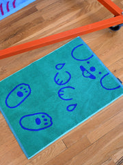 "WET DOGS" bath mat design by Natali Koromoto. Part of the "Wet Dogs" bath collection. Made in Portugal with BCI cotton, Oeko Tex Standard 100.