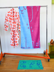 "WET DOGS" collection of bath towel, bathmat, and shower curtain. By illustrator/designer Natali Koromoto.