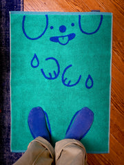 "WET DOGS" bath mat design by Natali Koromoto. Part of the "Wet Dogs" bath collection. Made in Portugal with BCI cotton, Oeko Tex Standard 100.
