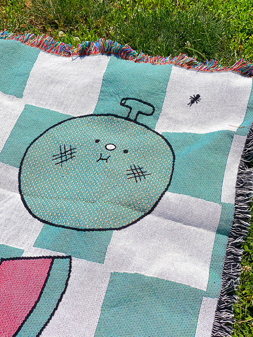 "The Picnic" woven cotton throw blanket. Designed in NYC by Natali Koromoto Martinez. Ethically made in the USA. OEKO-TEX Standard 100 certified.