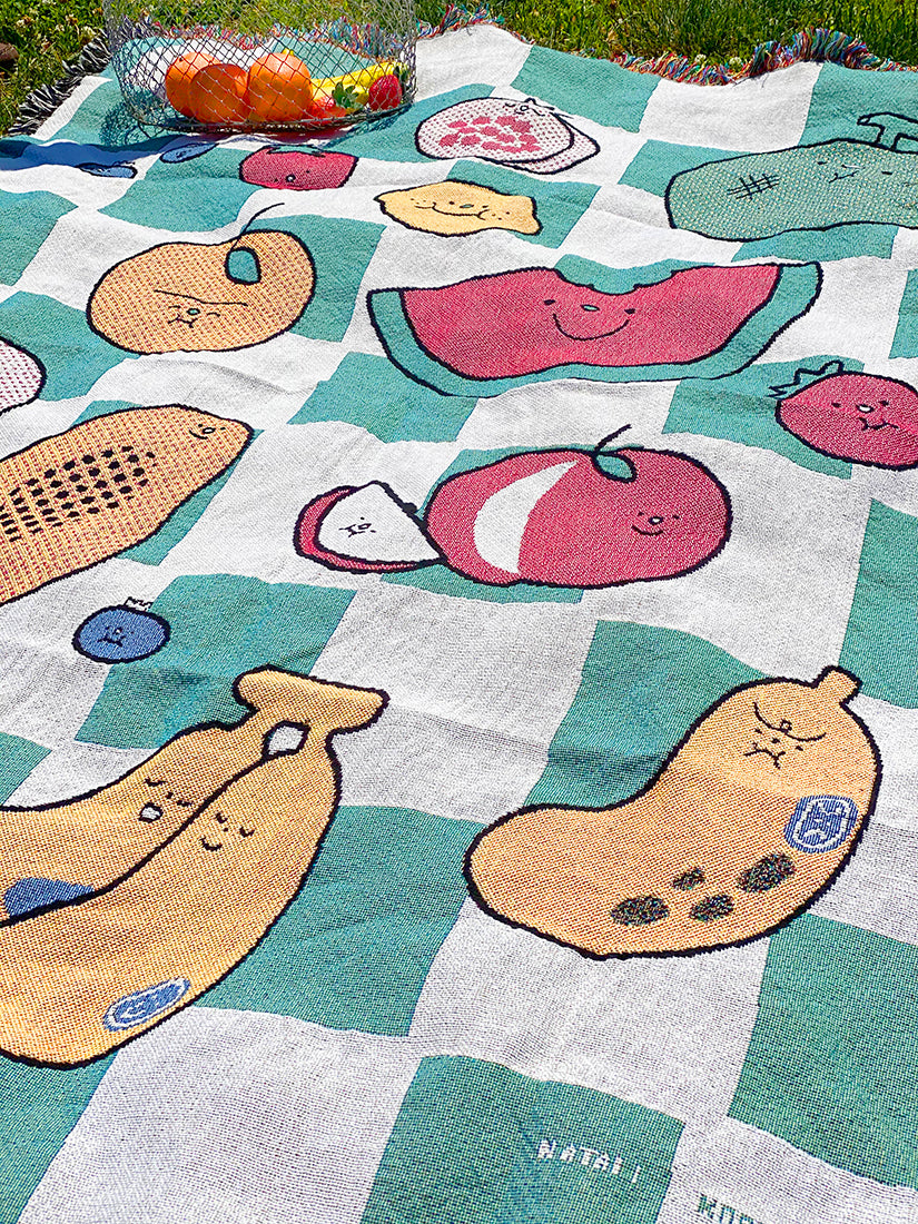 "The Picnic" woven cotton throw blanket. Designed in NYC by Natali Koromoto Martinez. Ethically made in the USA. OEKO-TEX Standard 100 certified.