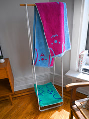 "WET DOGS" collection of bath towel, bathmat, and shower curtain. By illustrator/designer Natali Koromoto.