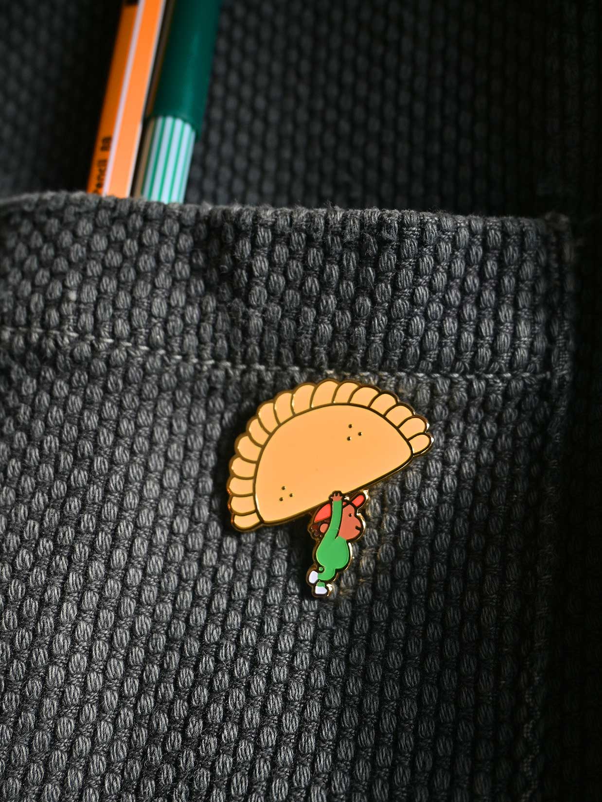 "Food on Parade" (Empanada) Enamel Pin. Design by Natali Koromoto Martinez (NYC)