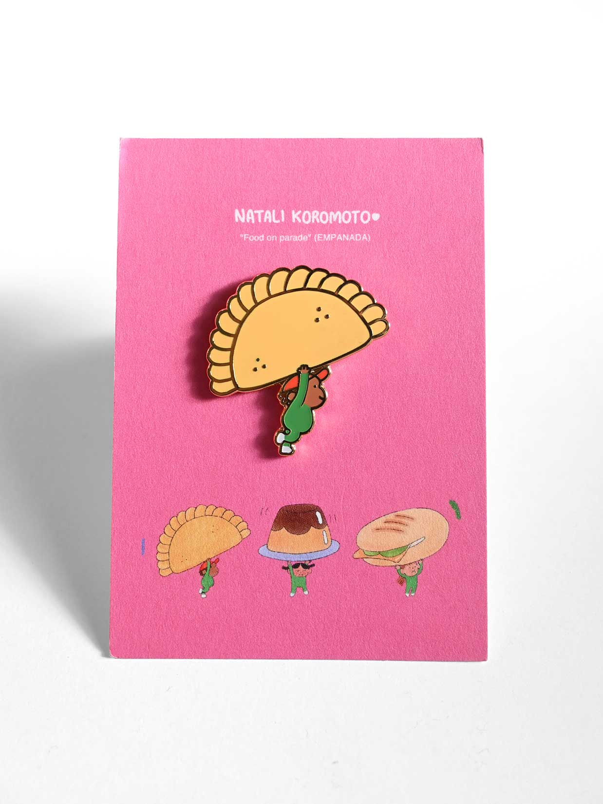 "Food on Parade" (Empanada) Enamel Pin. Design by Natali Koromoto Martinez (NYC)