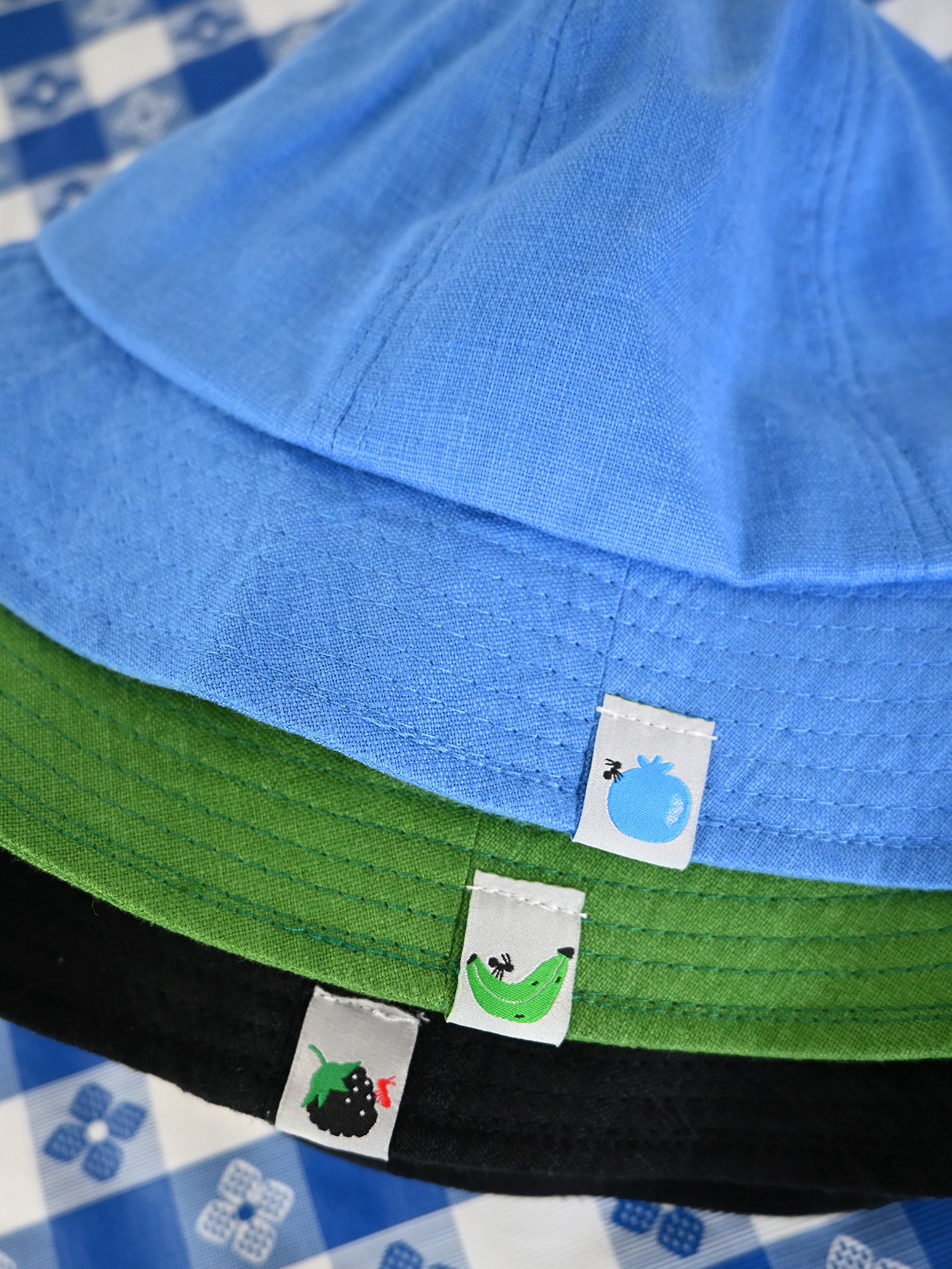 "Tutti-frutti" Linen bucket hats: Plantain, Blackberry, and Blueberry. Designed and made in NYC, USA by HO HOS HOLE IN THE WALL