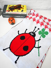 "Lucky Bug" Jumbo scarf. Made on Long Island, New York, USA, with recycled cotton and recycled polyester. Designed in NYC by Ho Hos Hole in The Wall. 12" x 78"