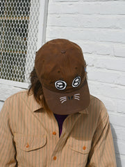 "ARGH-ARGH/SEAL" embroidered Cap design by Natali Koromoto. Made by Ho Hos Hole in The Wall. Waxed 100% cotton. Made in NYC.