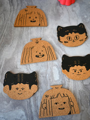"Cat Person" set of four cork coasters. Design by illustrator Natalí Koromoto Martínez.