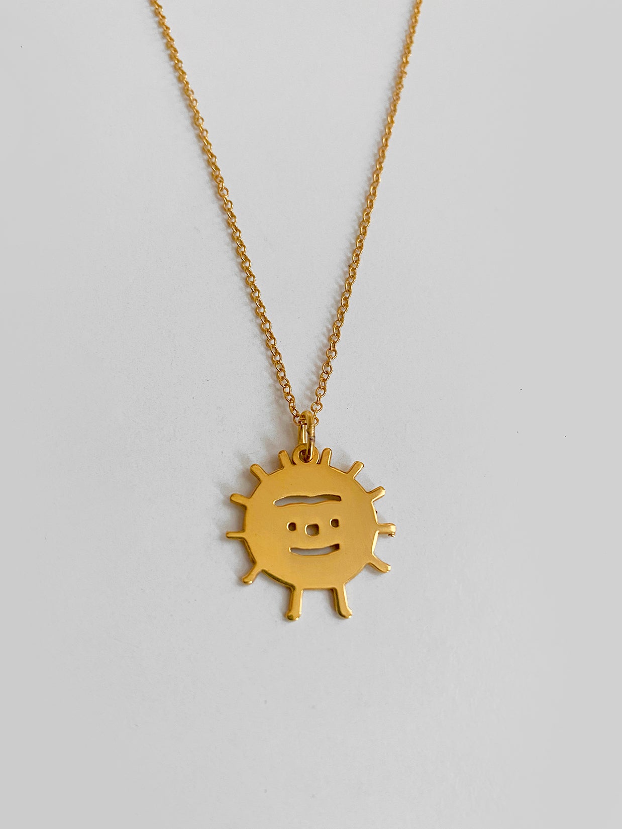 "Sunny-Side-Up" Vermeil pendant. Design by Natali Koromoto.