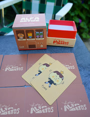 "Los Alfabetos" is a memory card matching game set of 26 pairs of Latin food characters. Designed by illustrator Natalí Koromoto Martínez.