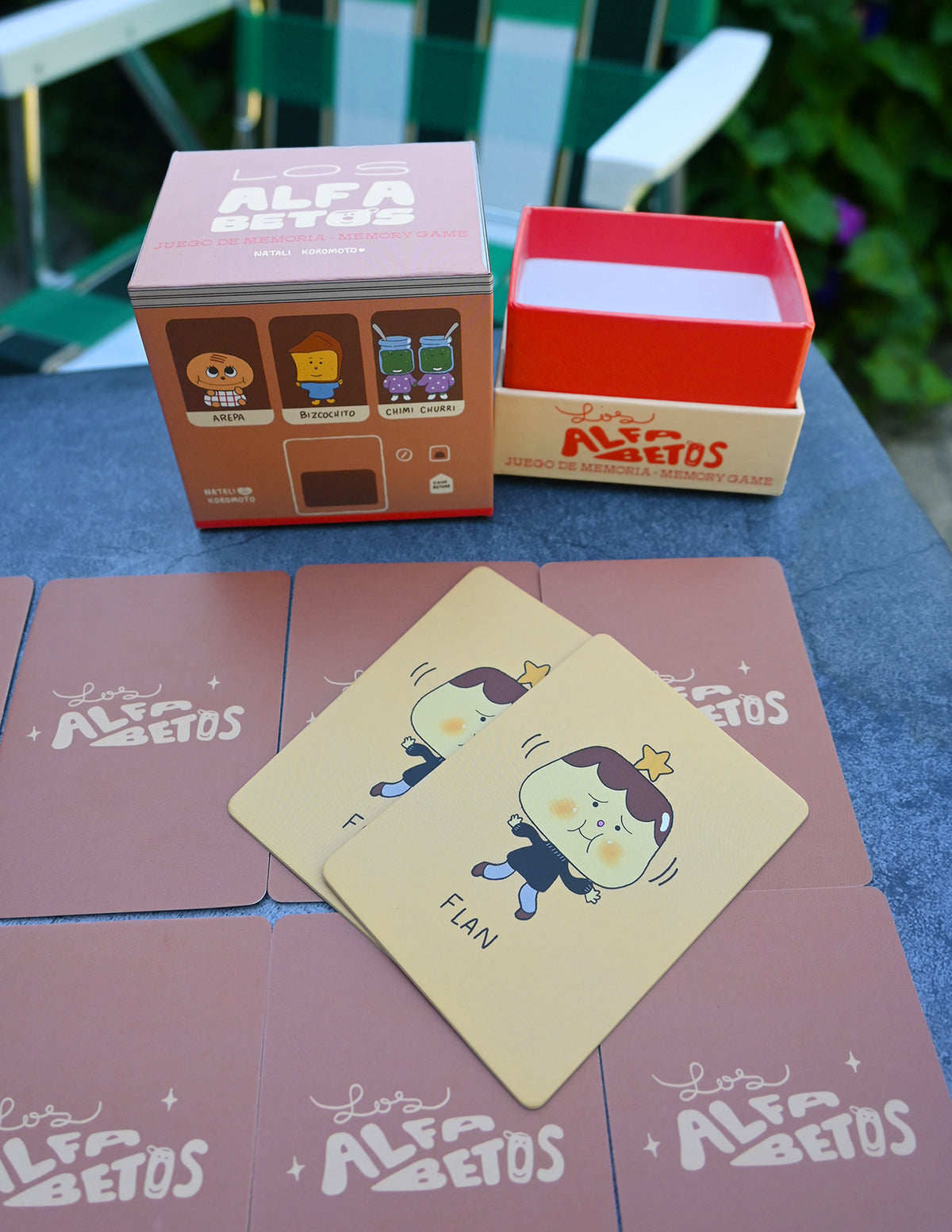 "Los Alfabetos" is a memory card matching game set of 26 pairs of Latin food characters. Designed by illustrator Natalí Koromoto Martínez.