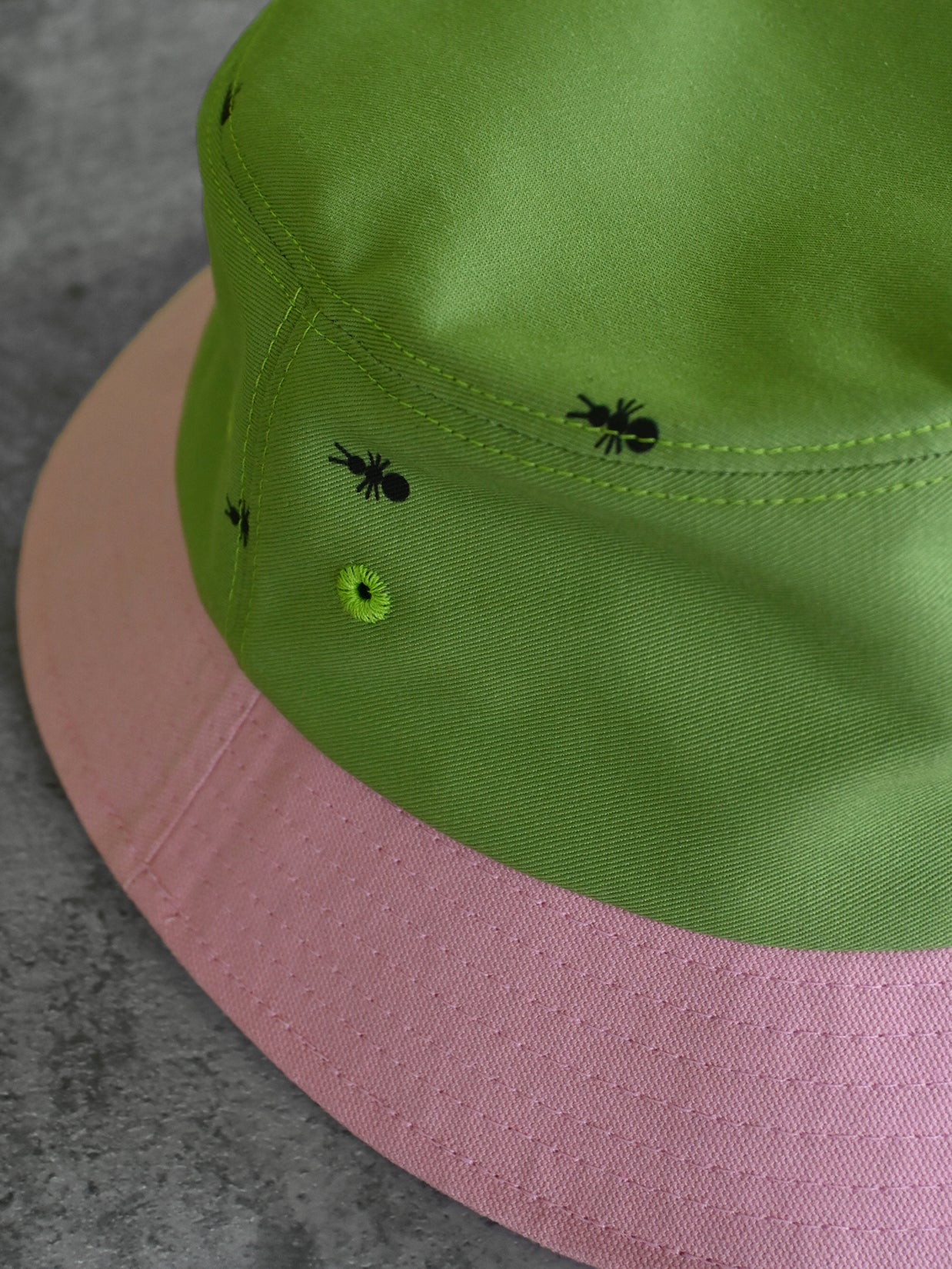 Natali Koromoto x HO HOS HOLE IN THE WALL brand "Ants on Your Hat" printed bucket hat in Avocado Green and True Pink dye colorway combo