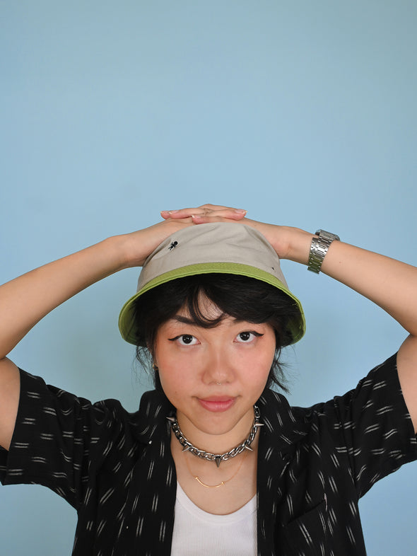 Natali Koromoto x HO HOS HOLE IN THE WALL brands "Ants on Your Hat"  print design bucket hat in Pearl Grey and Avocado Green dye colorway organic cotton fabric combo
