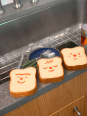 Poundcake/Ponqué sponge design by Natali Koromoto Martinez. Unibrow, Freckles, and Sleepy characters.