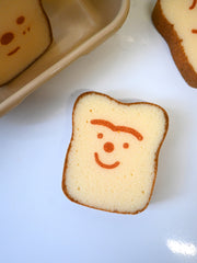 Poundcake/Ponqué sponge design by Natali Koromoto Martinez. Unibrow character.