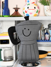 Throw pillow: Smiling espresso percolator character with thumbs up handle for an arm. Design by illustrator Natali Koromoto.