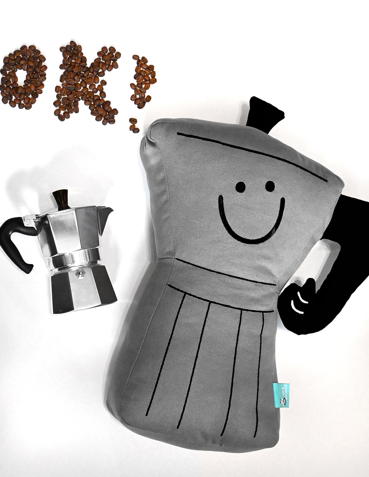 Throw pillow: Smiling espresso percolator character with thumbs up handle for an arm. Design by illustrator Natali Koromoto.