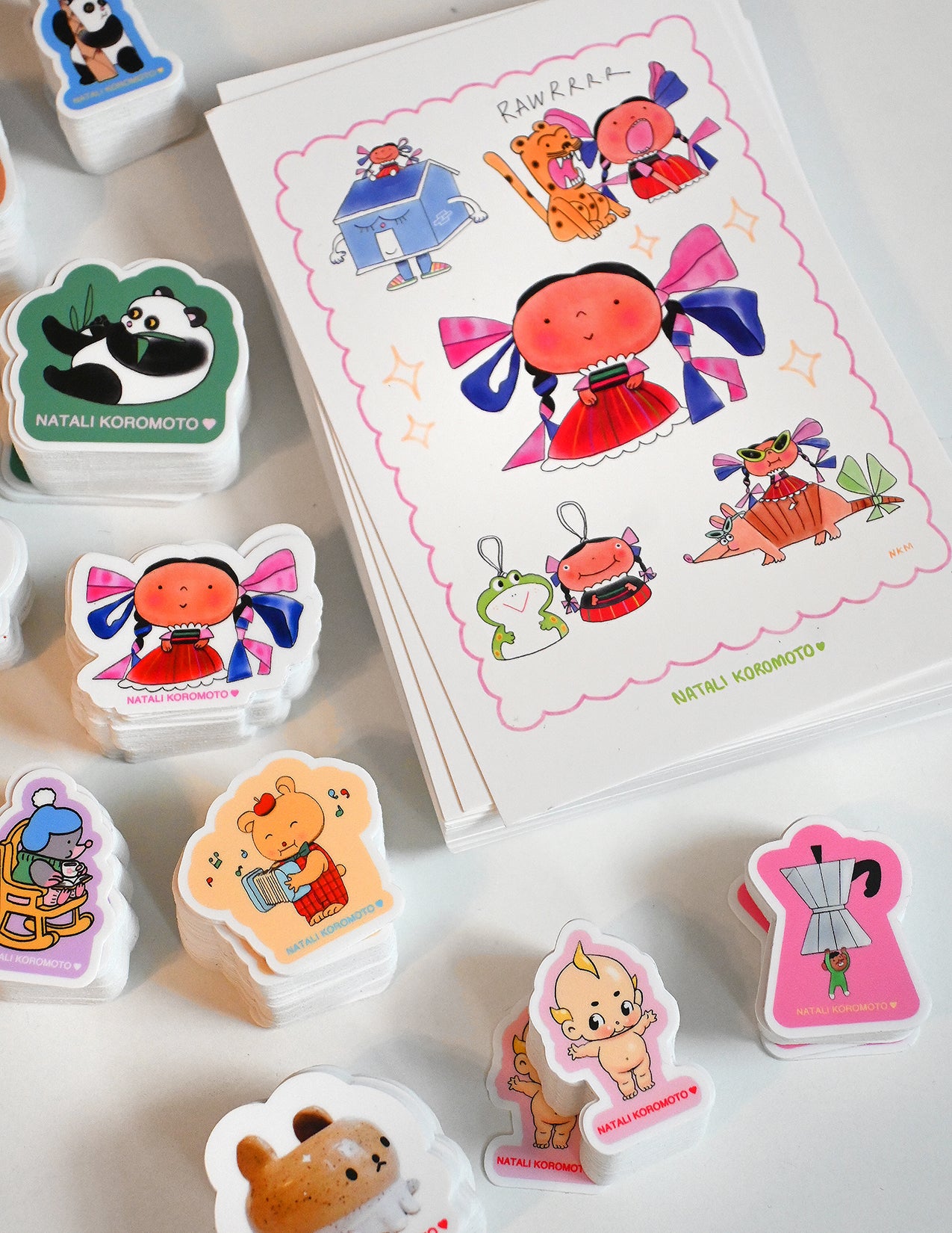 Pack of 10 vinyl stickers, Sticky Friends Edition #4. Designs by Natali Koromoto.
Includes one 4" x 6" postcard. 