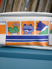 "The Passengers" pencil pouch by Natali Koromoto showing full side view with animal characters enjoying their adventure on the Shinkansen bullet train.